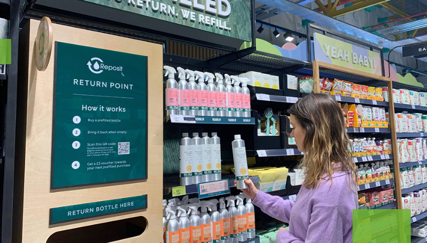 woman selecting shampoo in a reusable bottle at the grocery store