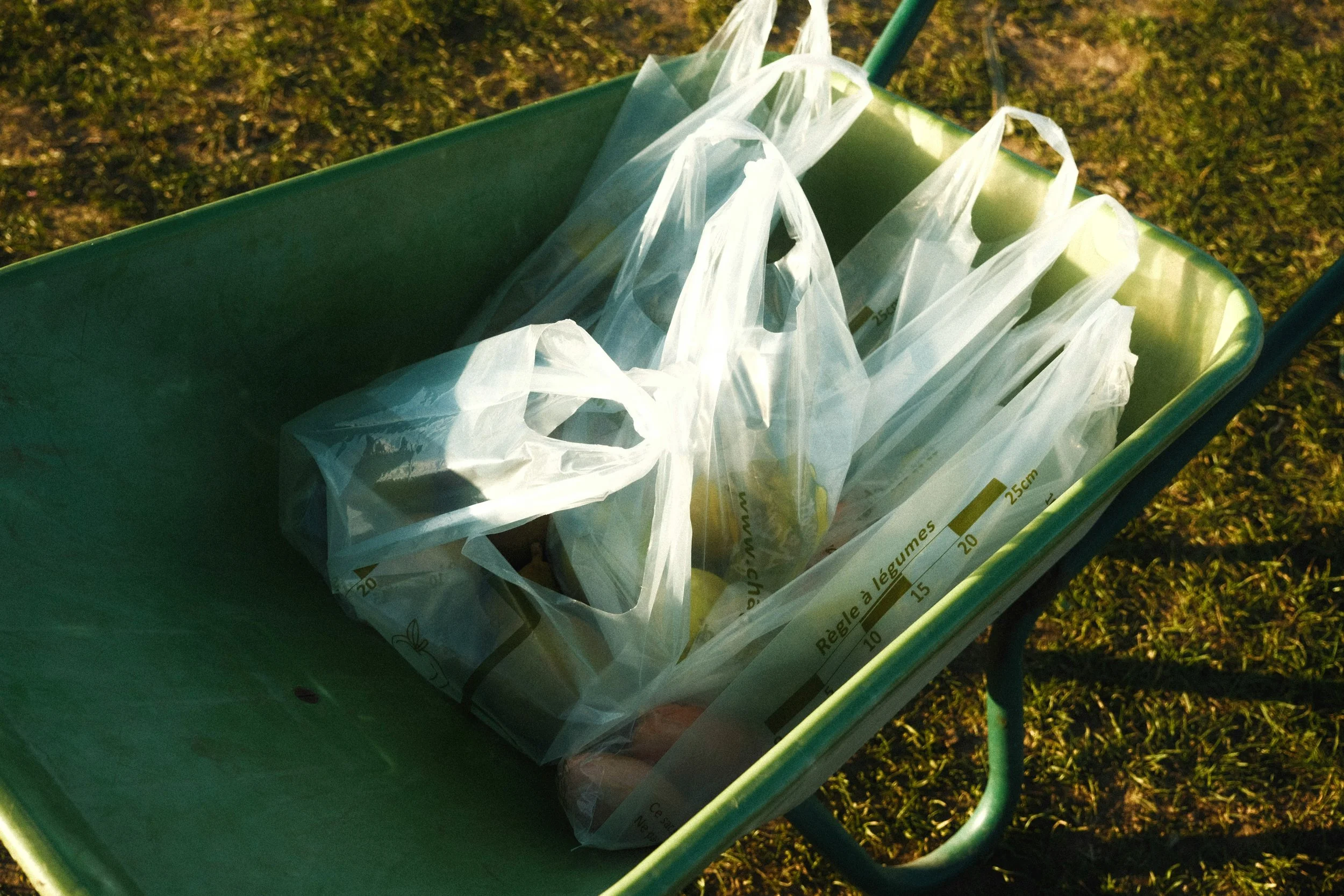 biodegradable plastic bags in a garden cart