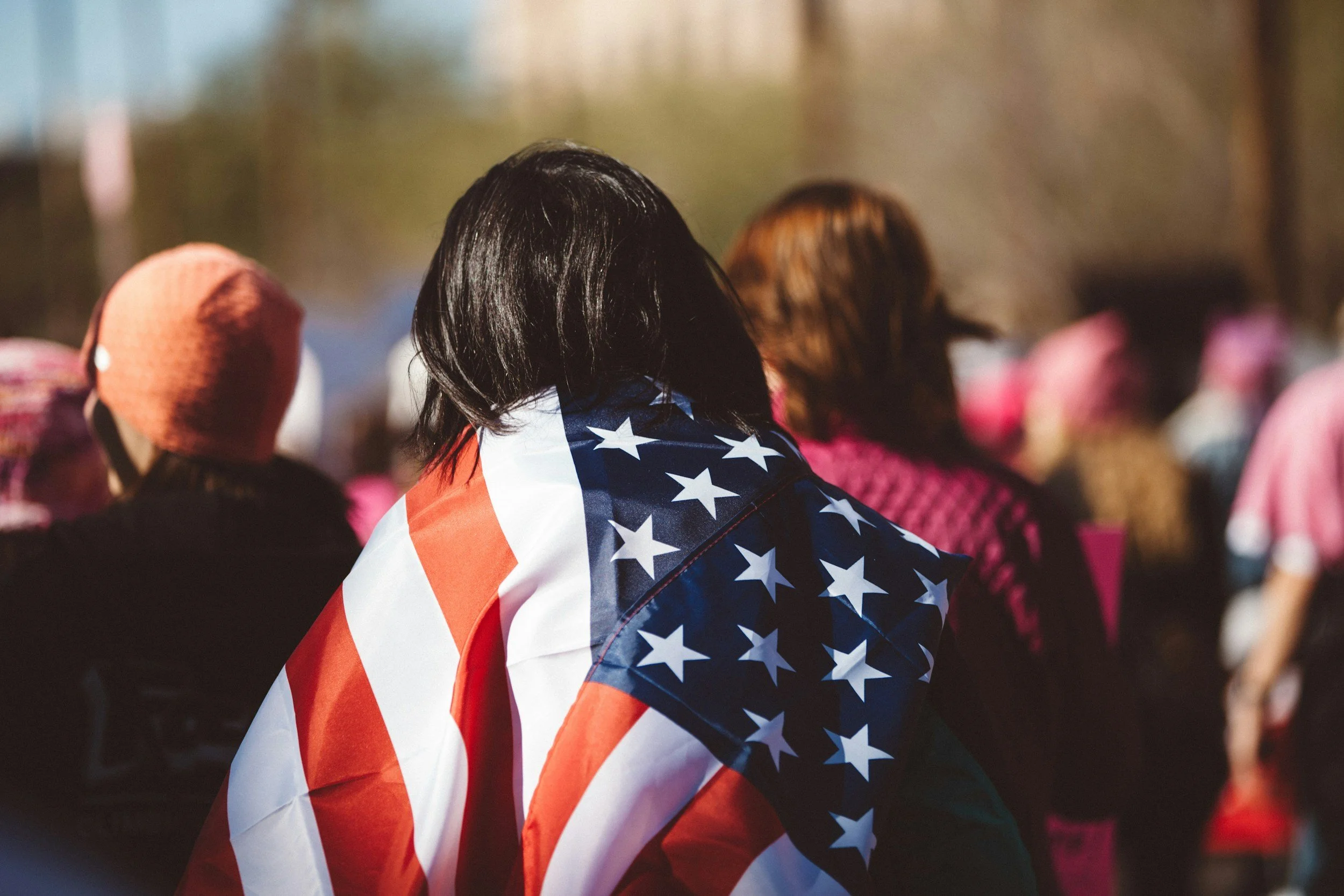 person with the American flag on his back