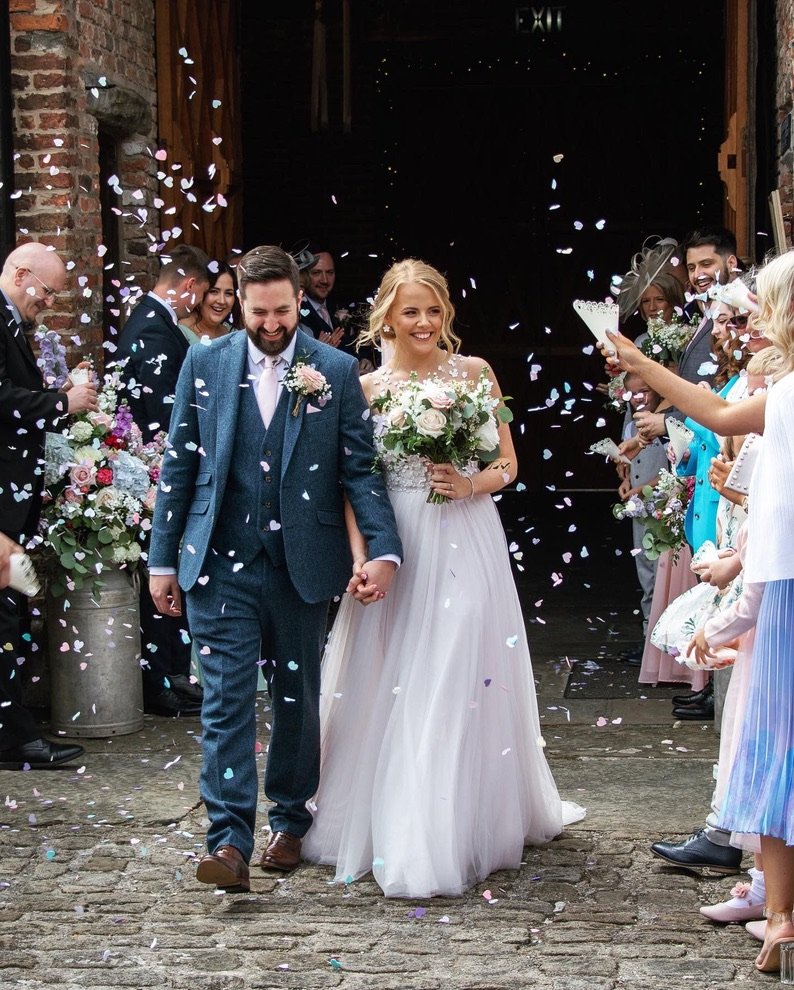 Confetti and flowers at the doors of Meols hall