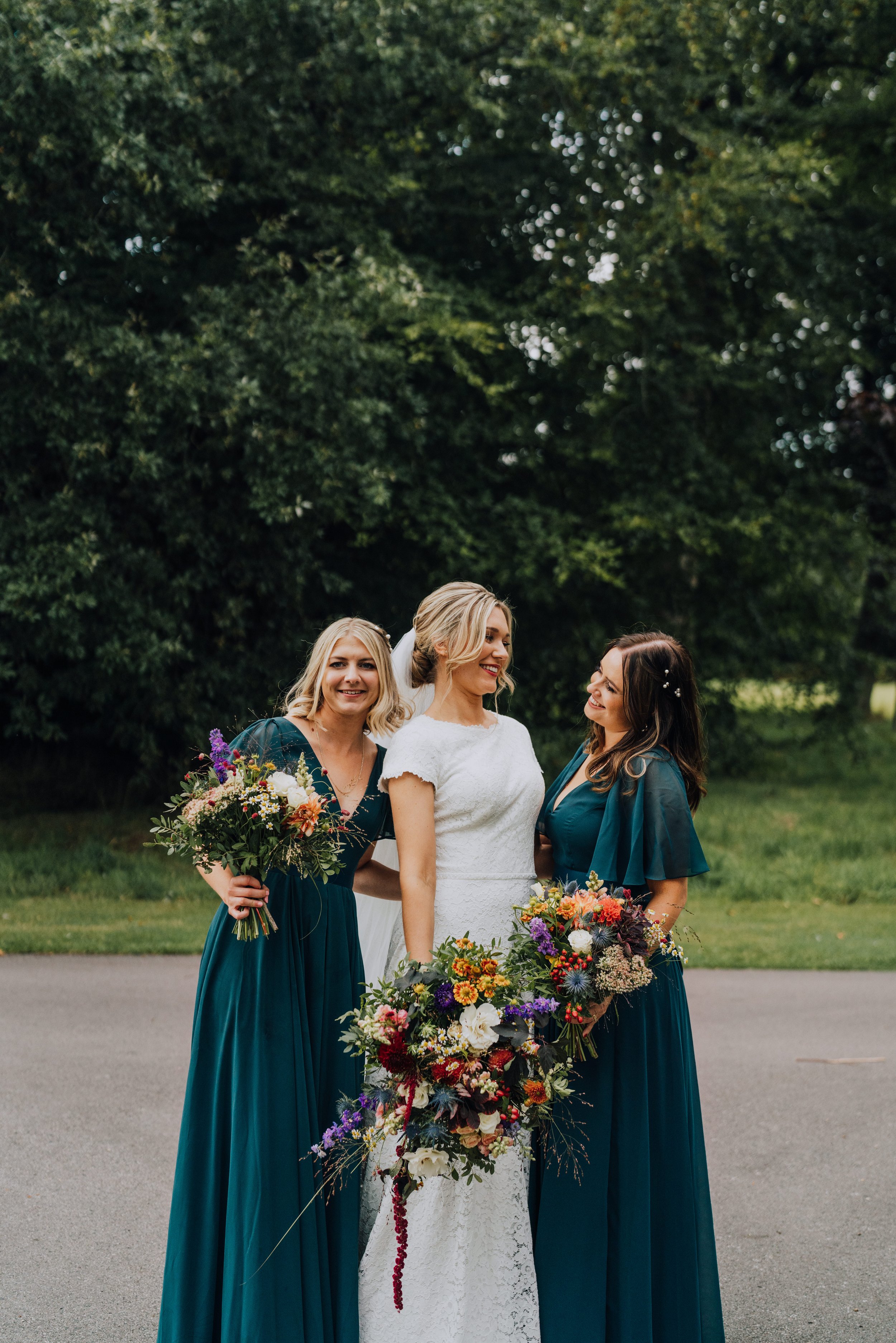 Bride and her bridesmaids with their bouquets
