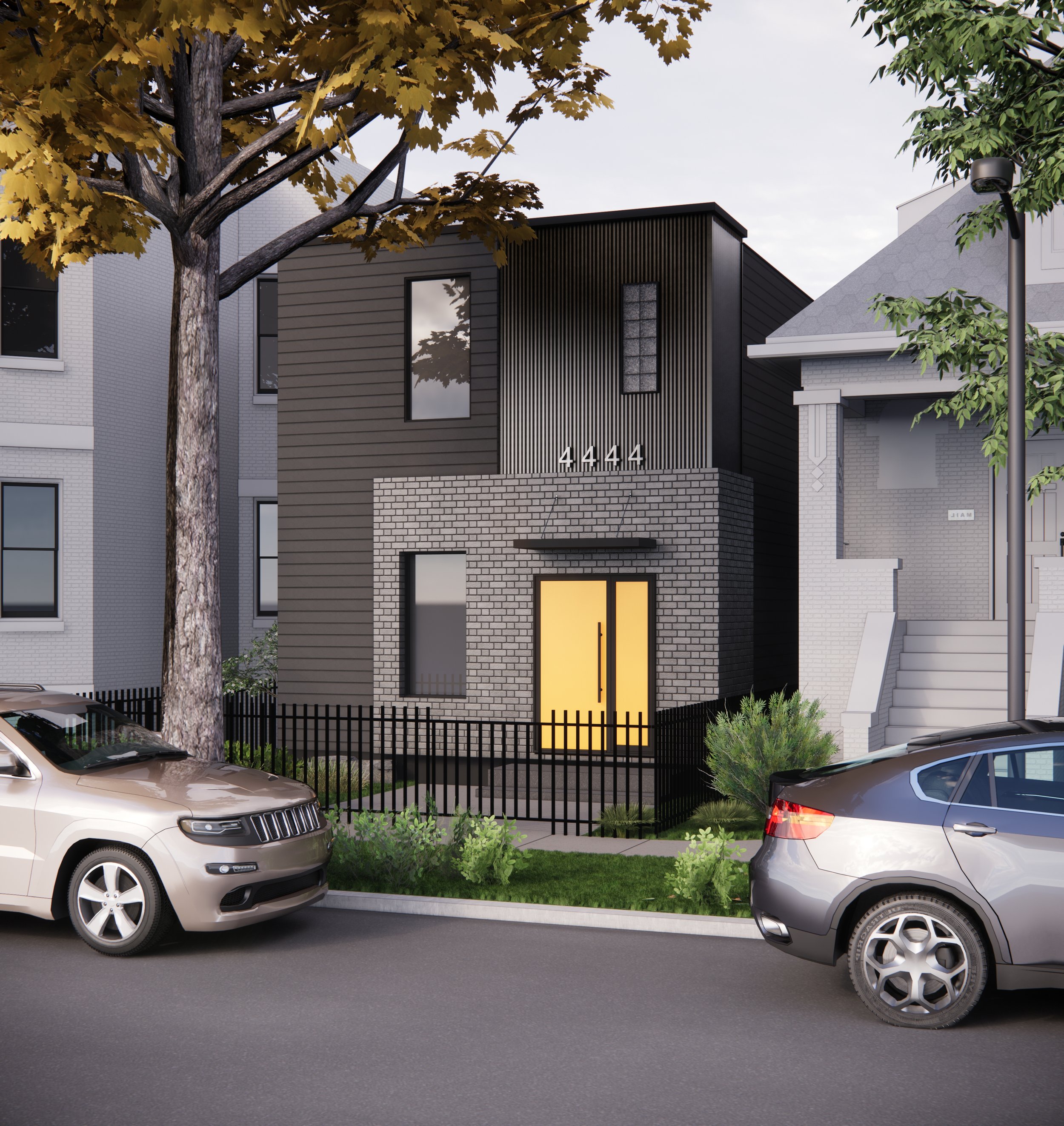 Modern urban townhouse with dark and brick exterior, and yellow front door.
