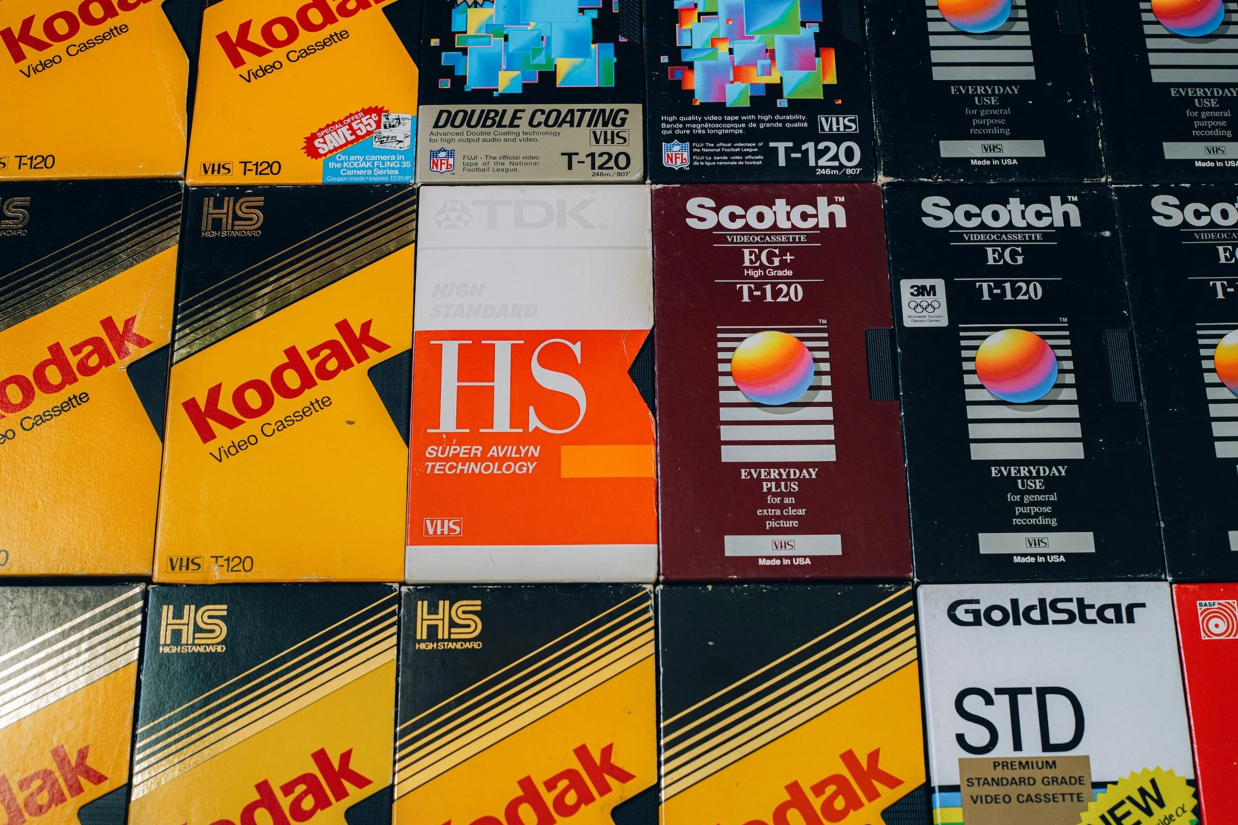 A collection of different brands of videotapes