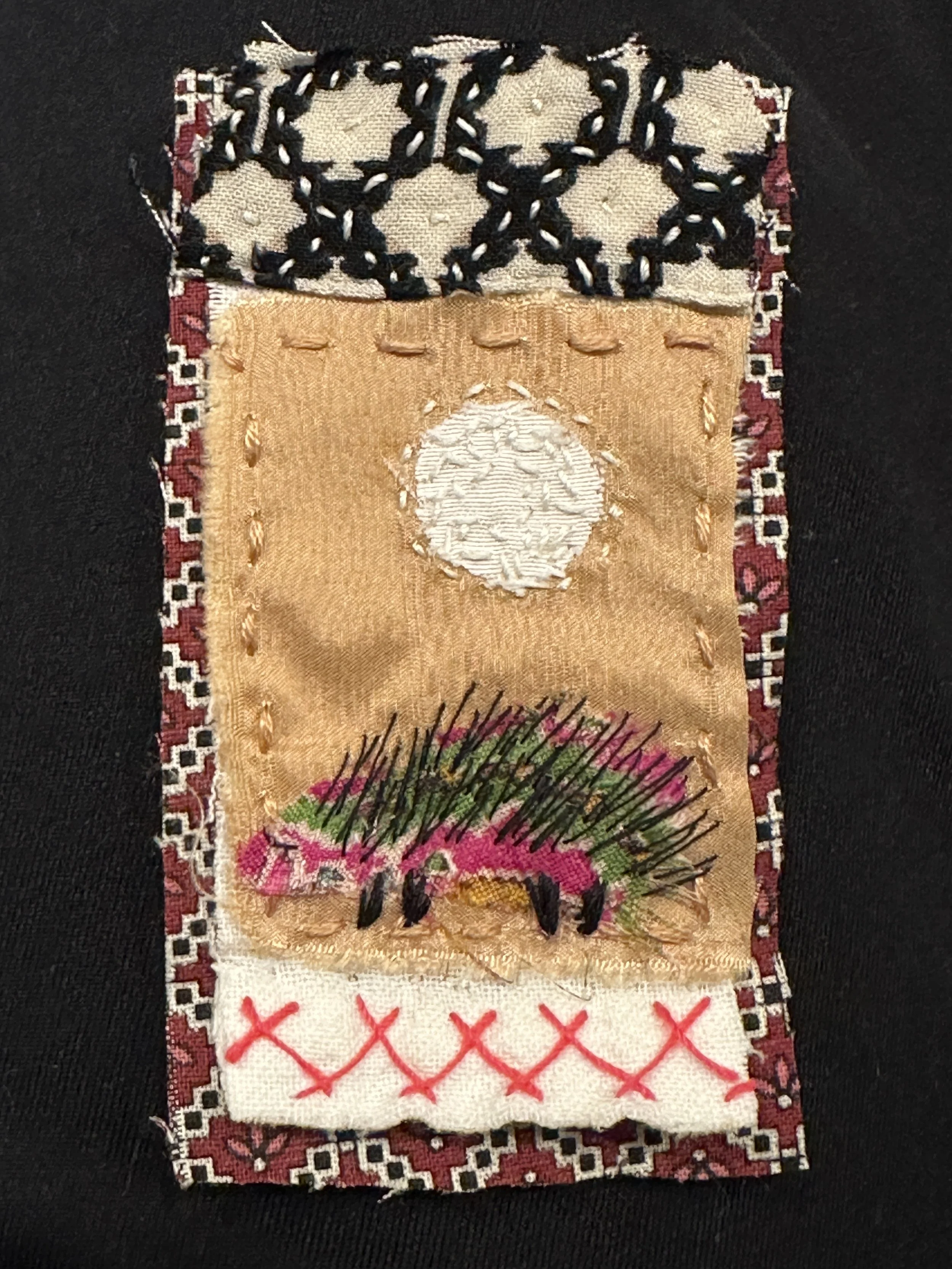 Slow-stitch fabric collage brooch (Shier 2025)