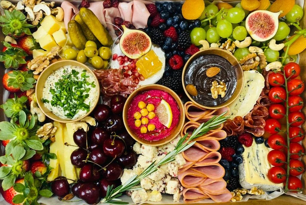 A vibrant and fresh deluxe large platter with amazing homemade dips