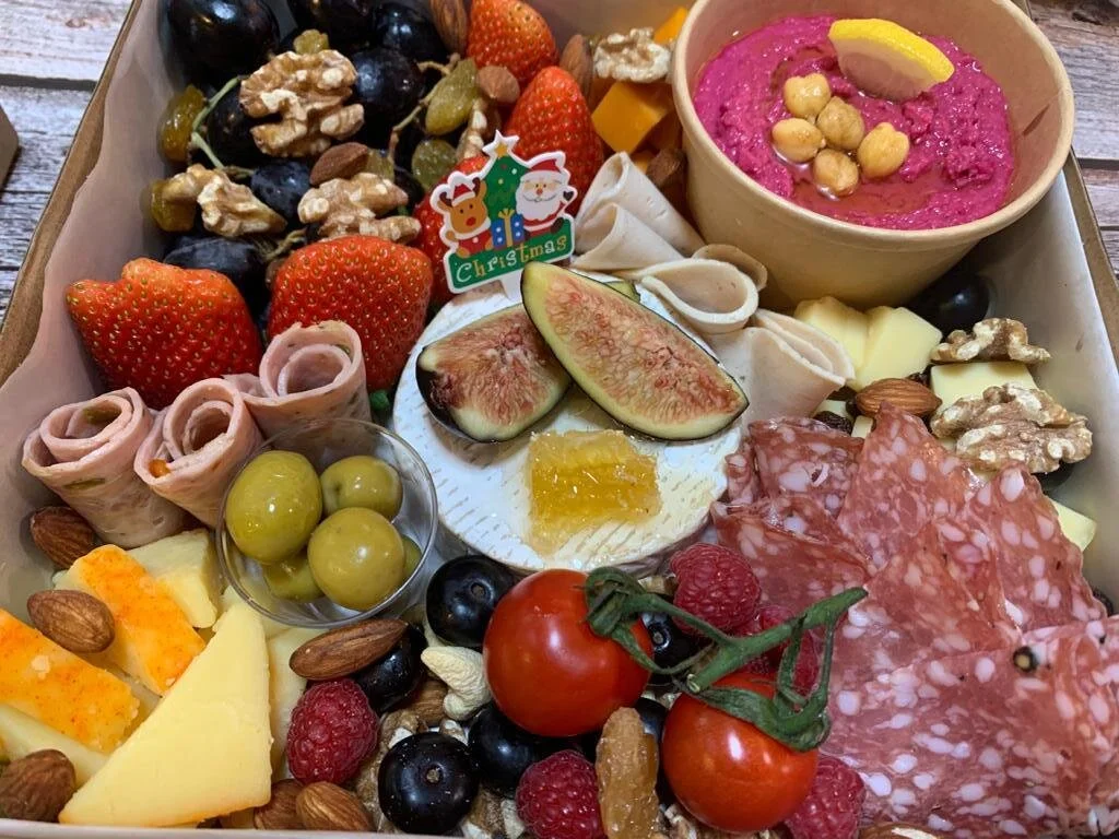 A cheese platter meticulously crafted with the finest ingredients