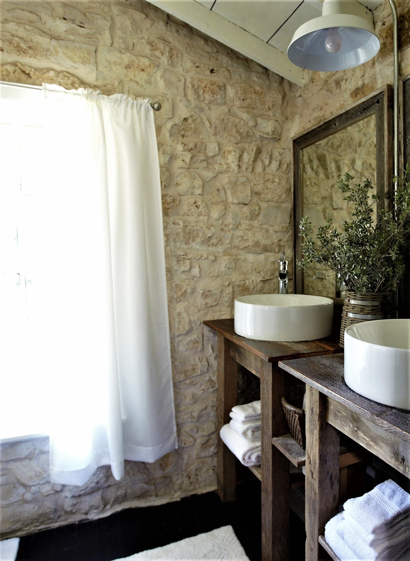 stone bathroom with two sinks