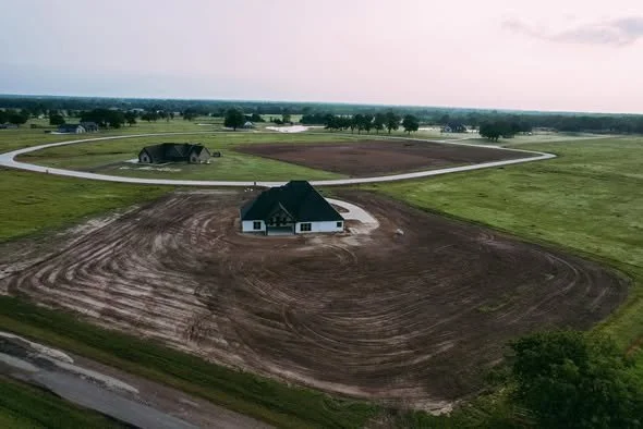 Aerial drone shot of new home construction and large residential lots at Bridgewater.