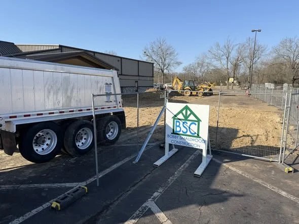 Bobby Smallwood Construction site with BSC signage and heavy machinery for land clearing.