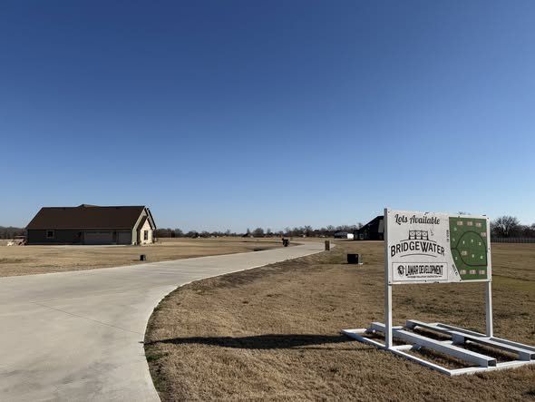 Bridgewater development lot map sign and paved road in Paris Texas.