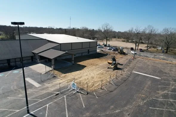 Aerial view of commercial site preparation and parking lot grading in Paris Texas.