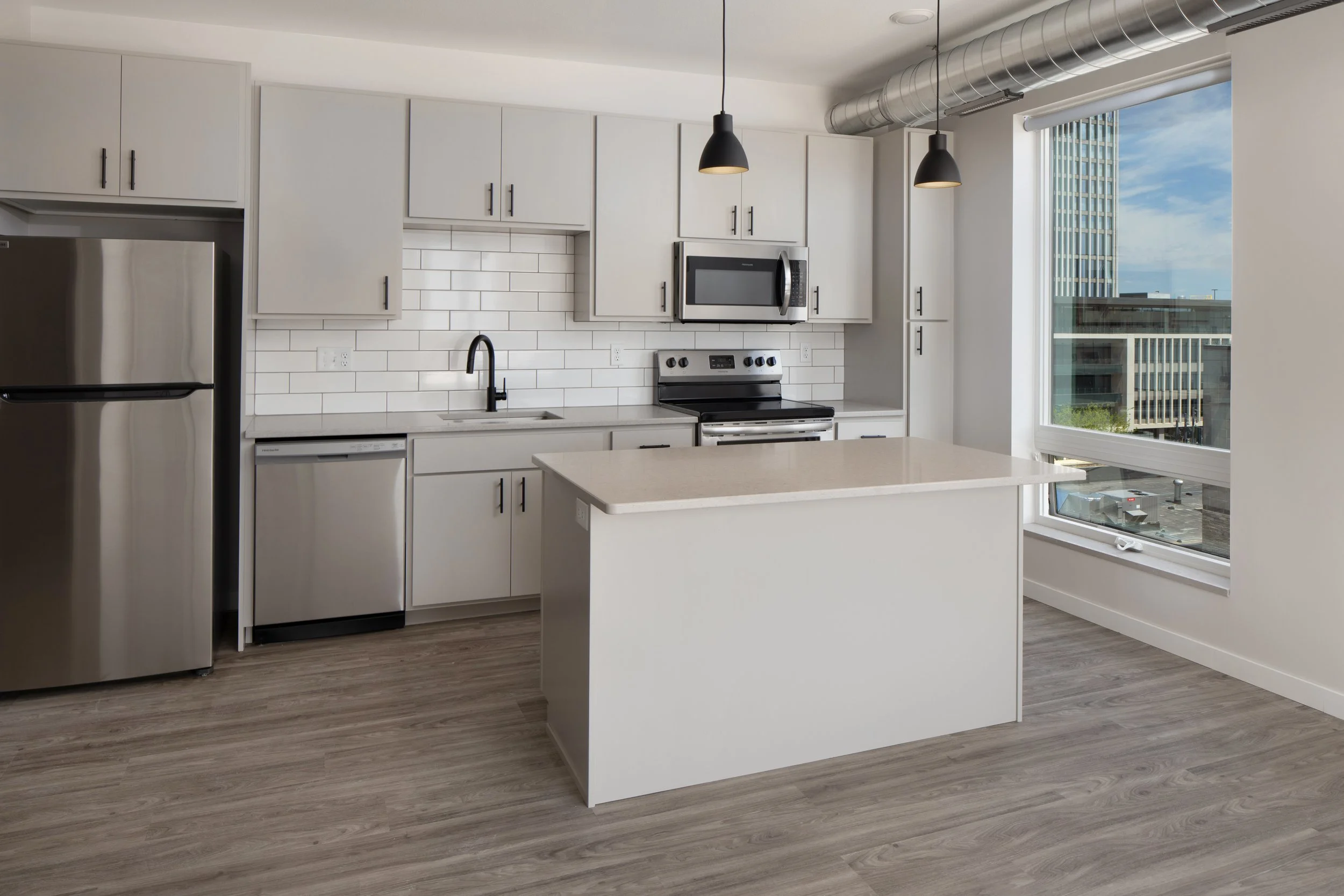   Looking for a kitchen that looks stylish AND has a great view?    Kesler    has you covered. PC: Dan Francis Photography.  
