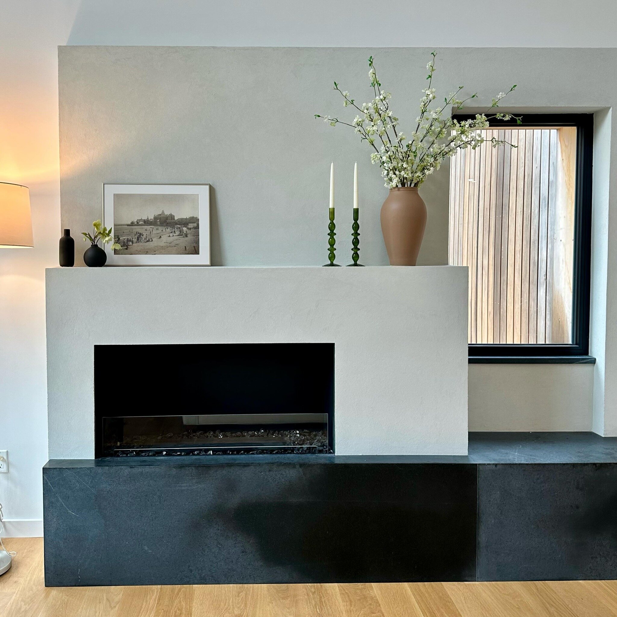 Home is where the hearth is. When designing a NetZero home, the fireplace area can contribute to significant heat loss and air leakage. However, most families still want a central focal point in the main living space to gather around.  Utilizing a ve