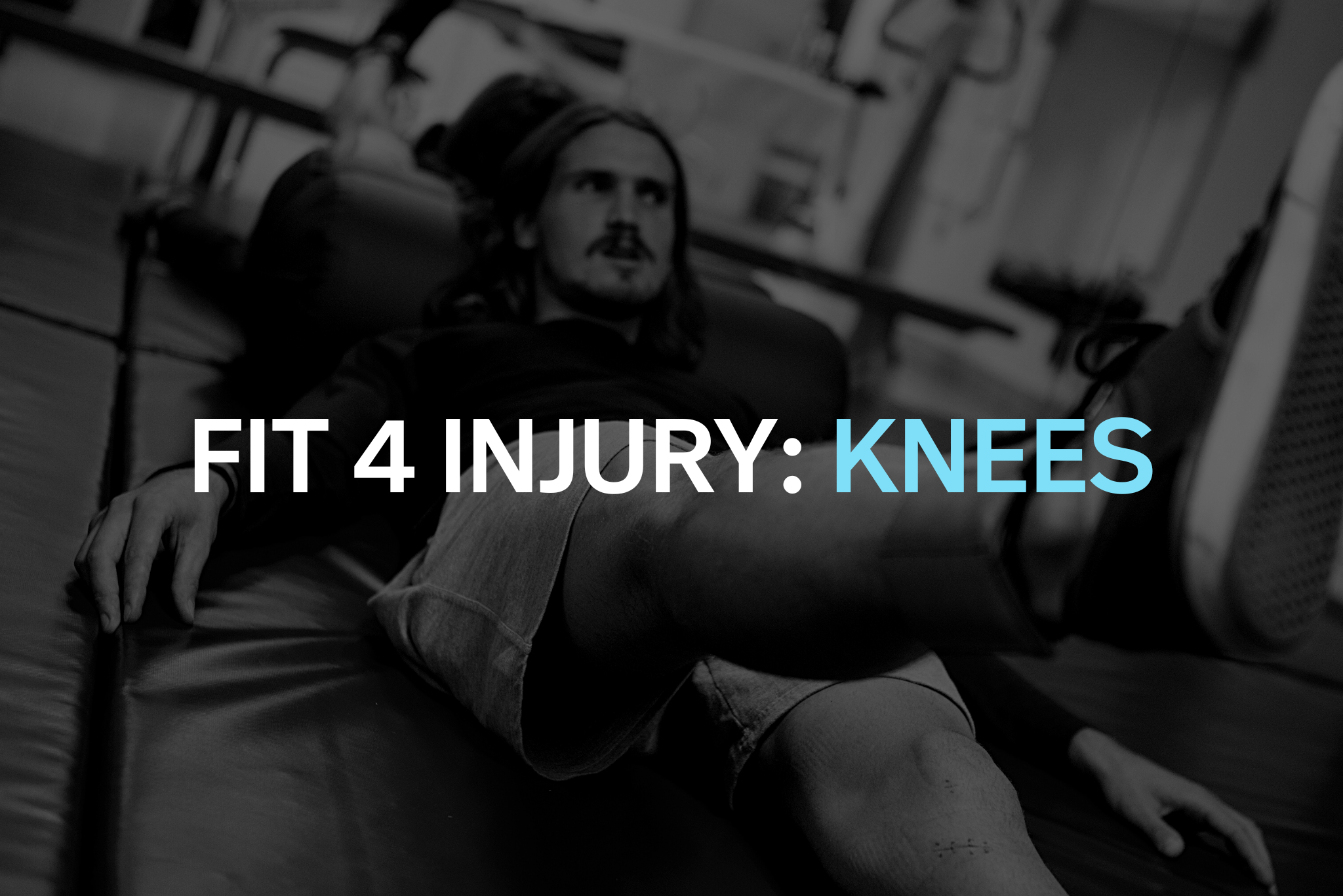 A man with long hair and a beard lying on a hospital bed with his leg in a cast, appearing to have sustained a knee injury.