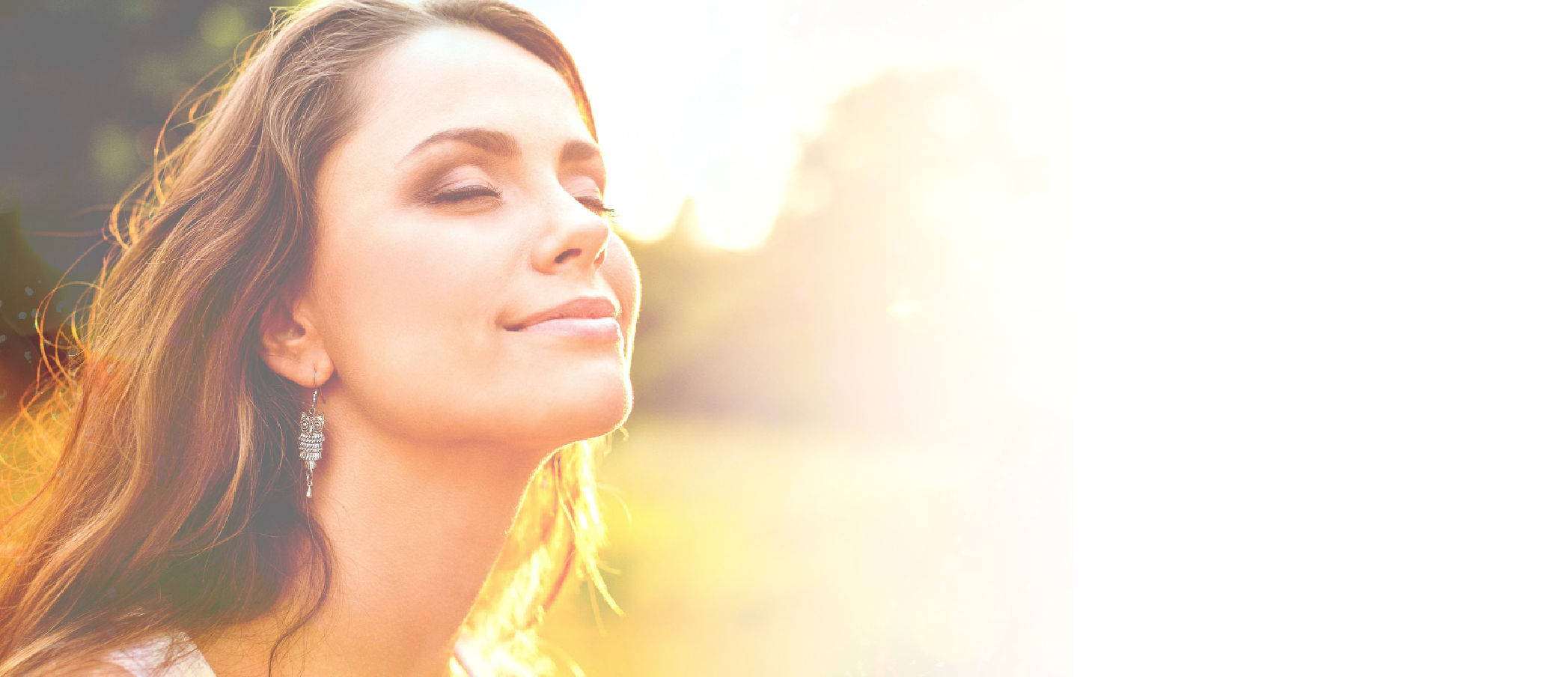 Woman enjoying the sun with her eyes closed.png