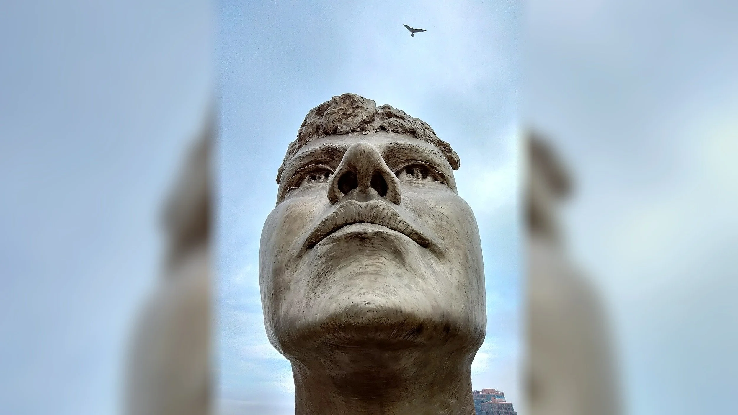The sculpted face of Nellie Bly, part of The Girl Puzzle art installiation on Roosevelt Island, New York.