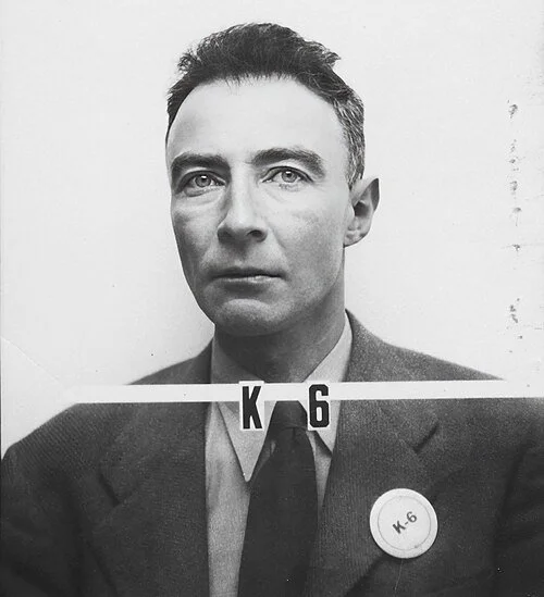 J. Robert Oppenheimer with Los Alamos ID badge.