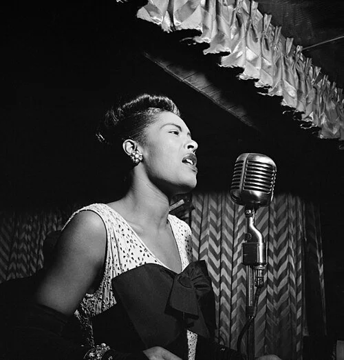 Billie Holiday singing at the Downbeat club in New York City, circa 1947