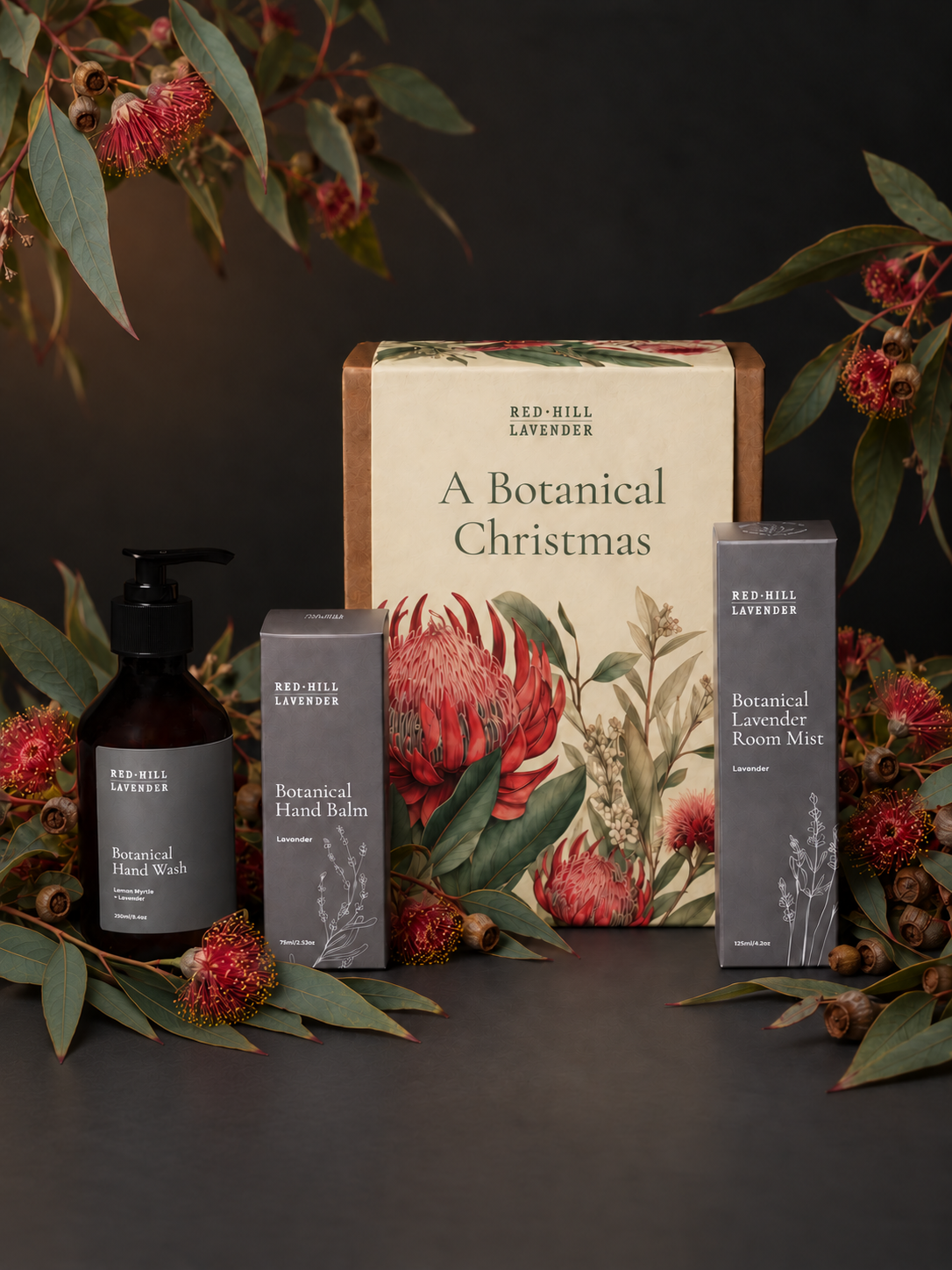 Botanical Christmas gifts on charcoal tabletop.png