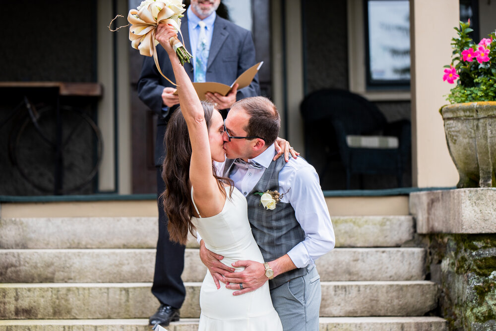 Bride celebrating during her first kiss at the Inn on Montford in Asheville, NC