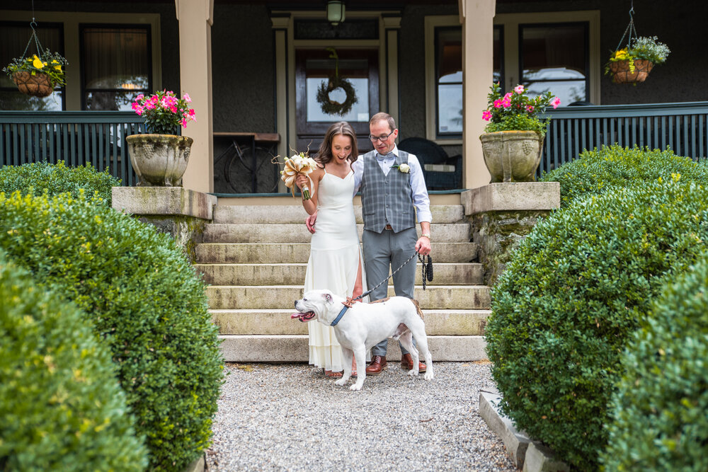 Bride, Groom, and their dog after their intimate wedding at the 1900 Inn on Montford