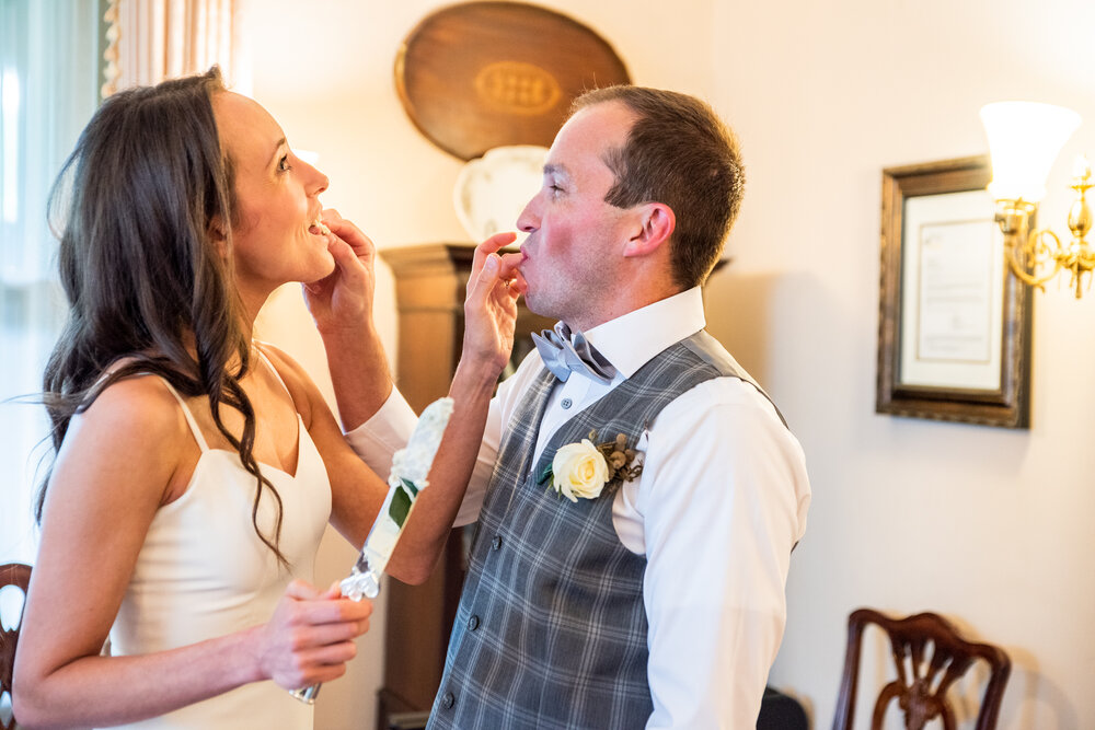 Bride and Groom eating their wedding cake from Weks of the Heart in the 1900 Inn on Montford, Asheville, NC