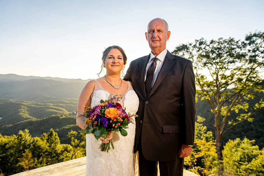 bride and her father posing for the camera at the parker mill in whittier, nc near asheville