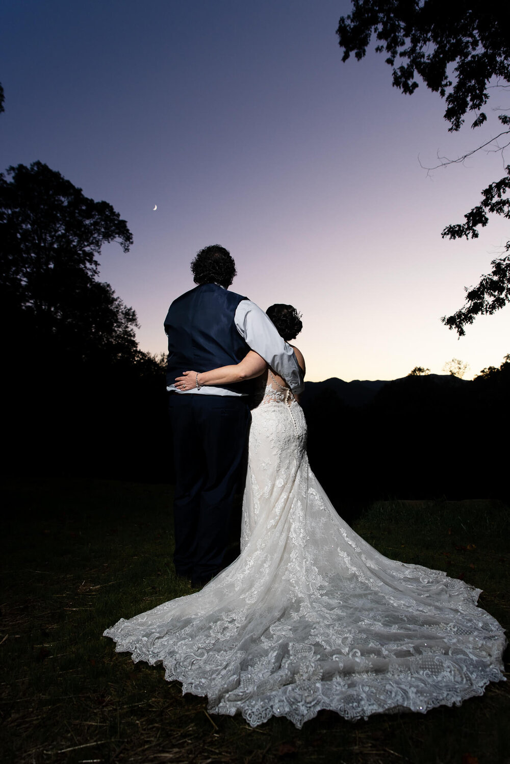 Bride and Groom looking at the moon during their wedding day at The Parker Mill in Whittier, NC