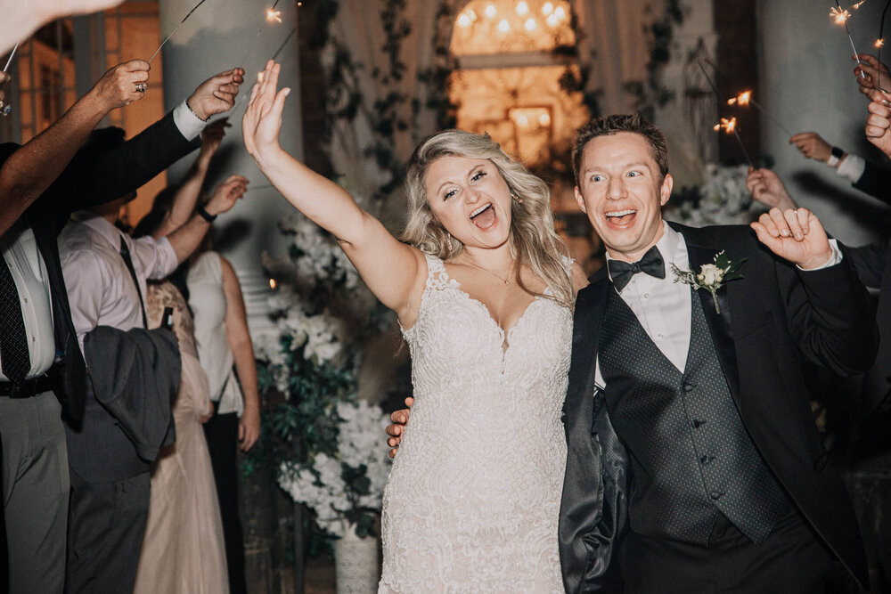 bride and groom sparkler exit outside the gassaway mansion wedding venue in greenville sc