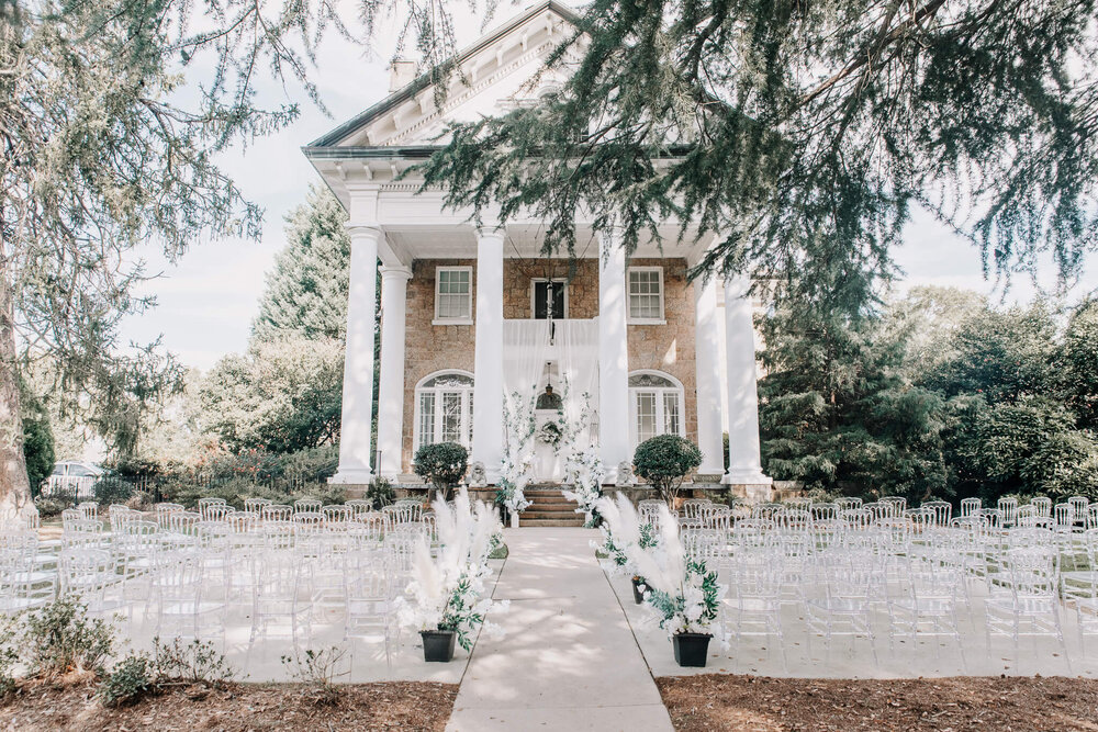 Front lawn wedding ceremony setup at gassaway mansion in greenville sc