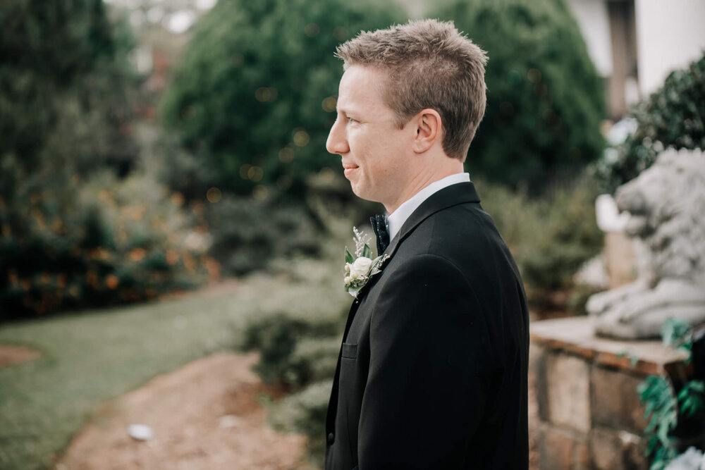 Groom seeing his bride for the first time at his wedding, photographed by greenville sc wedding photographer nick levine photography