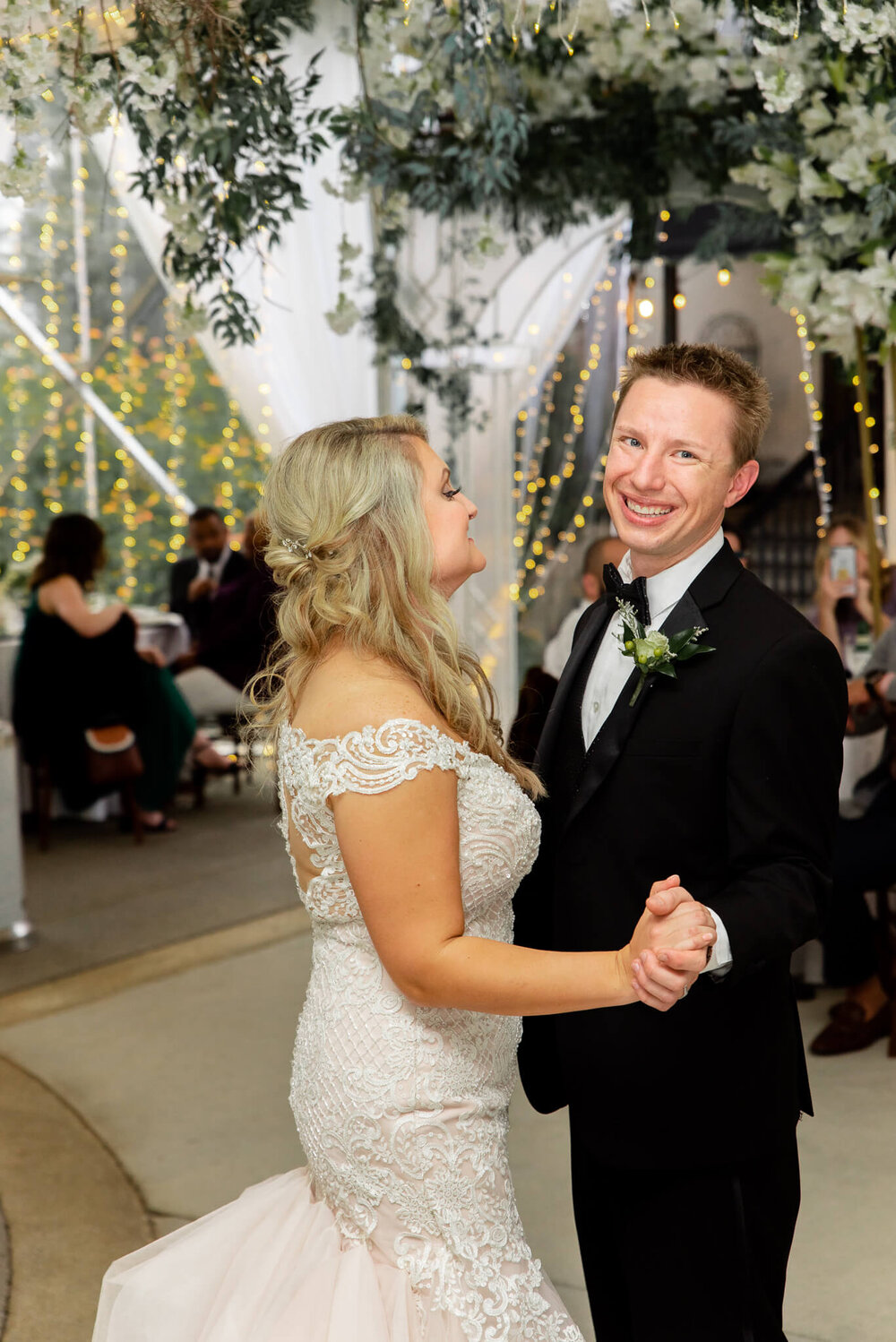 bride and groom at their wedding reception in a elegant tent at the gassaway mansion