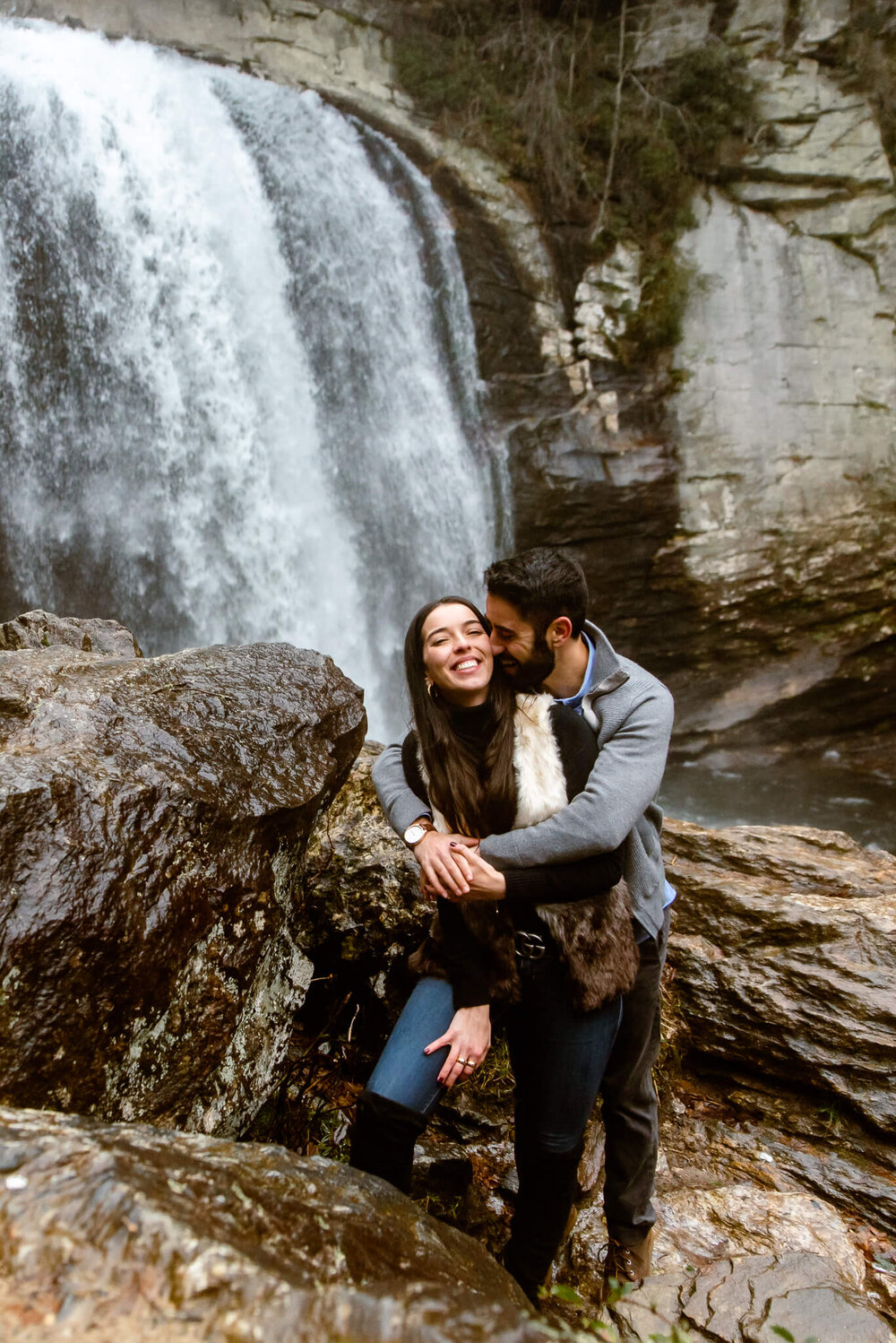 Winter waterfall surprise proposal at looking glass falls near asheville, nc by proposal photographer nick levine photography