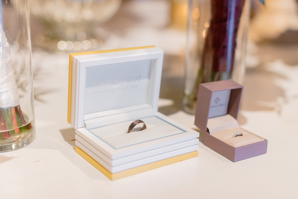 Wedding bands in their boxes on display at the venue asheville by nick levine photography