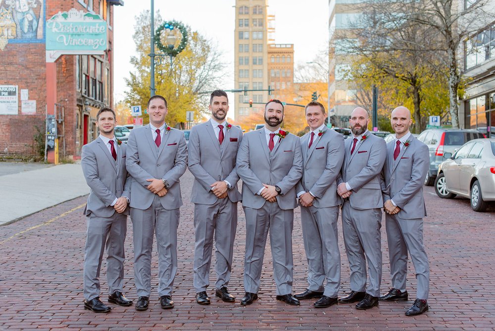 groom and groomsmen portrait outside the venue asheville along the brick road by nick levine photography