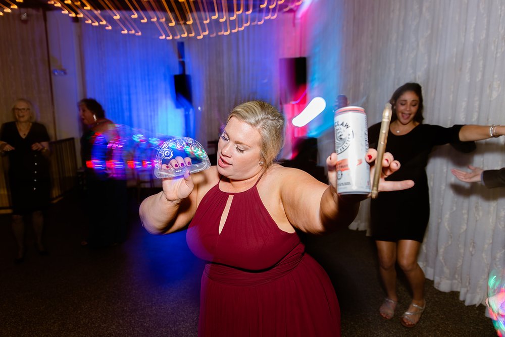 dance photos from the venue asheville with cool lights and white claw photographed by asheville wedding photographer nick levine photography
