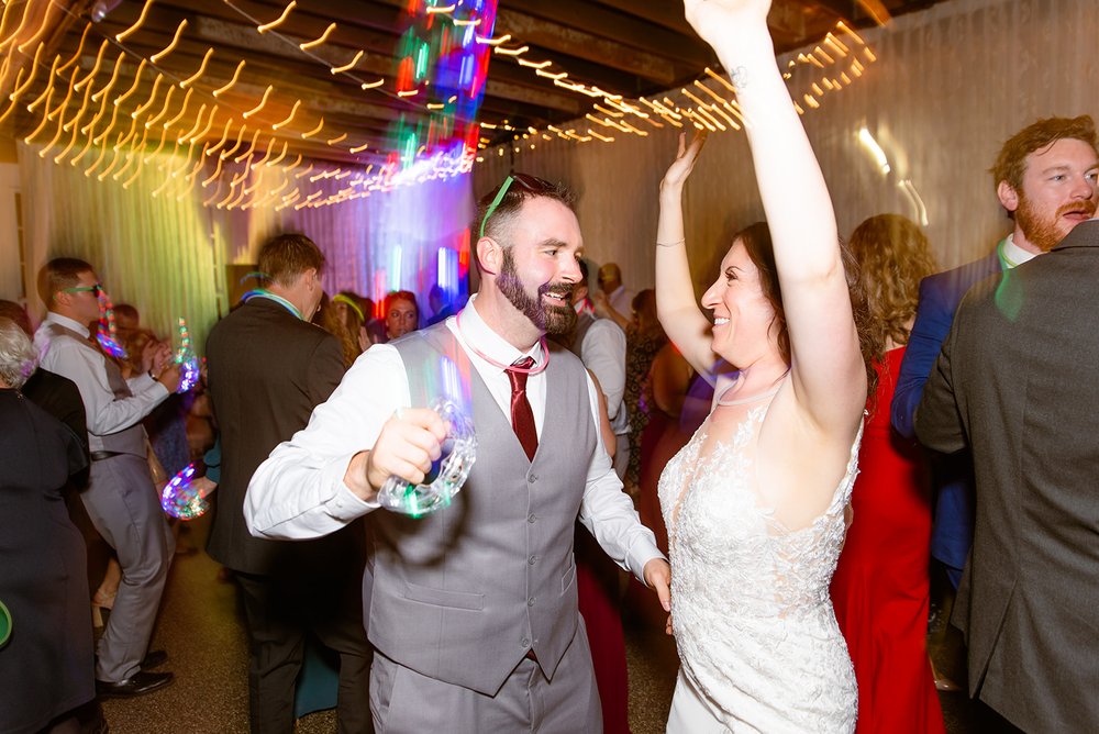 bride and groom dancing during their wedding reception at the venue asheville photographed by asheville wedding photographer