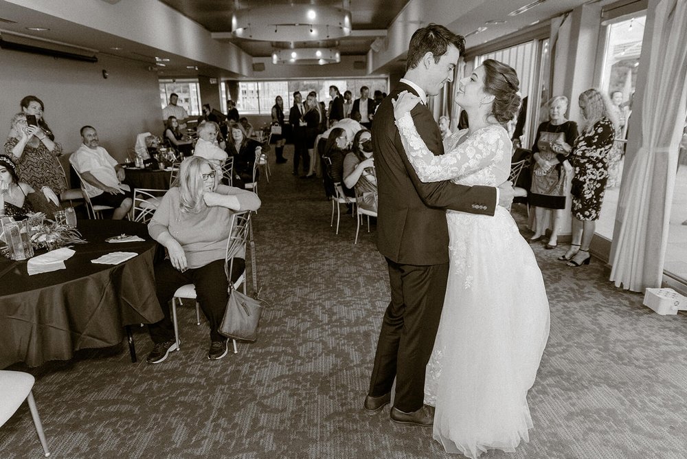 bride and groom sharing a first dance together in black and white photographed by asheville wedding photographer nick levine photography