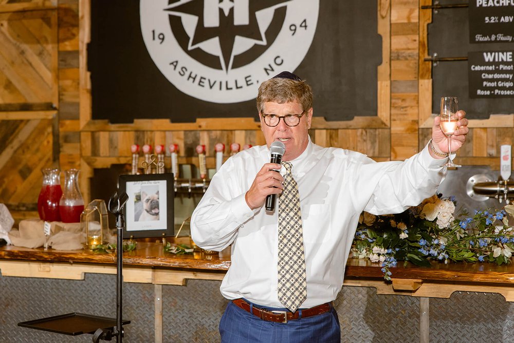 dad giving welcome toast at highland brewing wedding photo