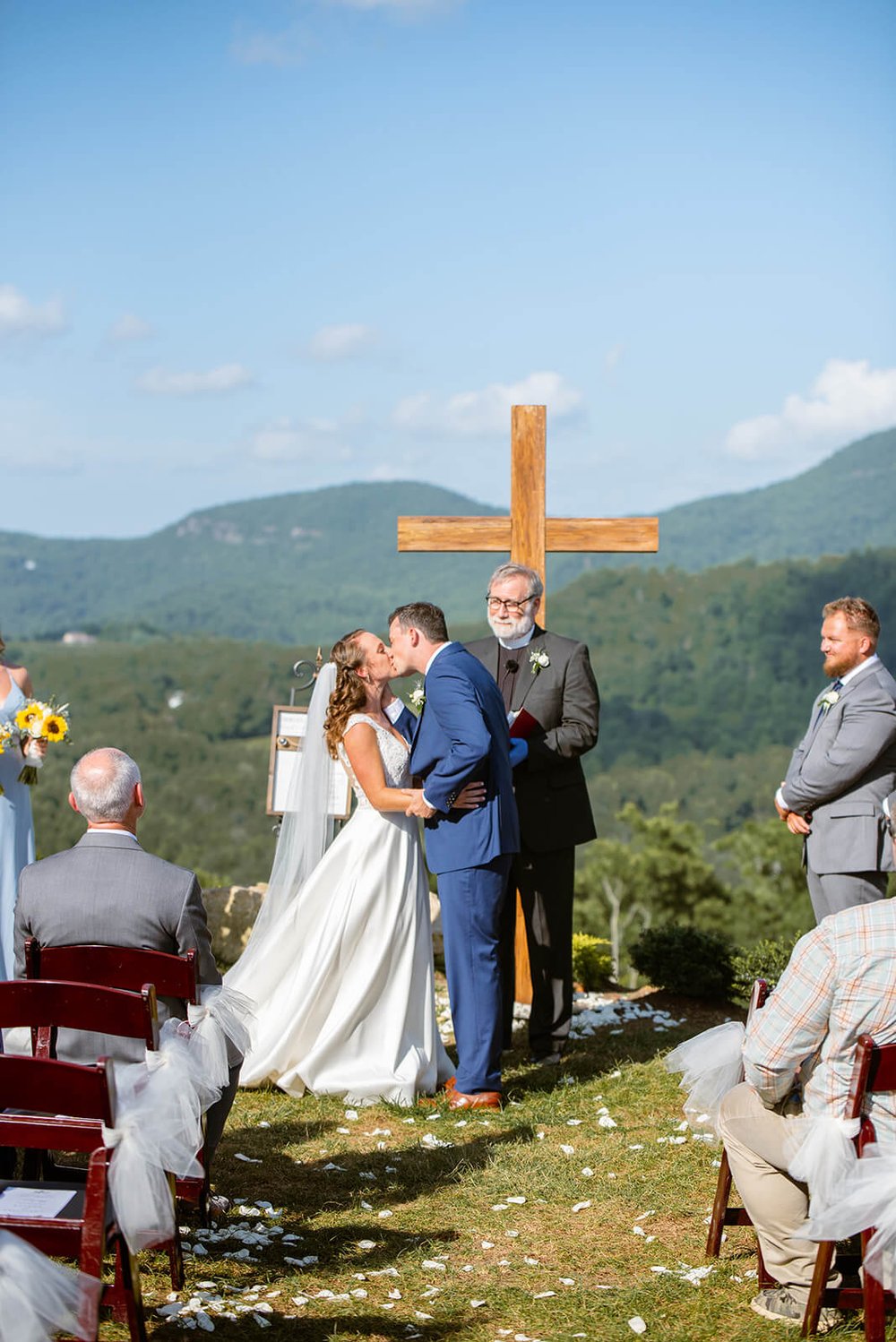 first kiss at point lookout vineyards wedding by asheville wedding photographer nick levine photography