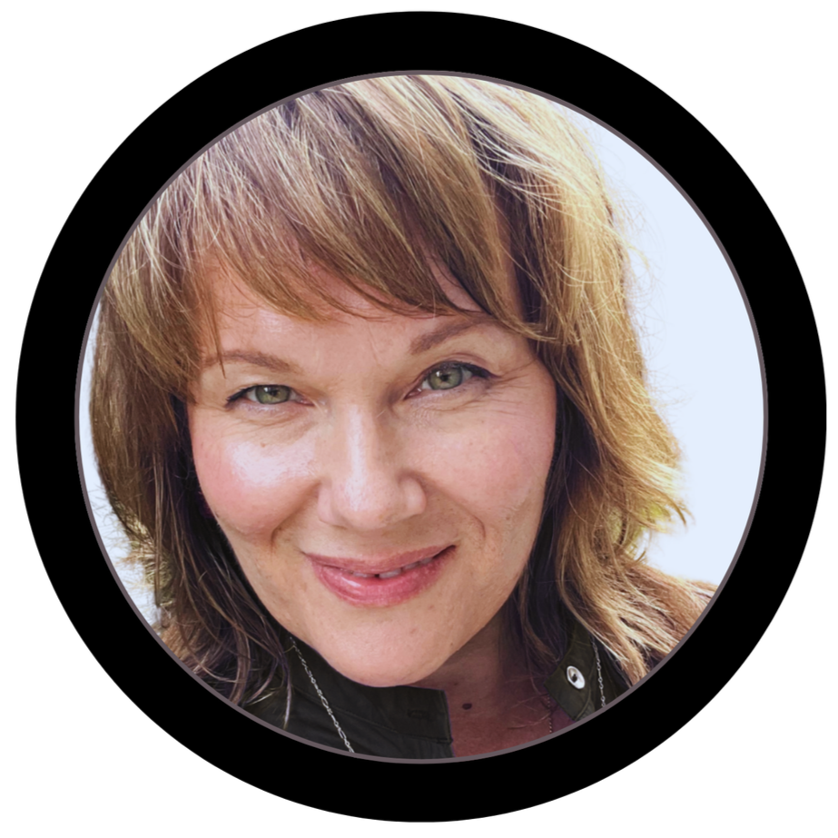 Close-up portrait of a woman with shoulder-length light brown hair, green eyes, and a slight smile, framed by a black circle.