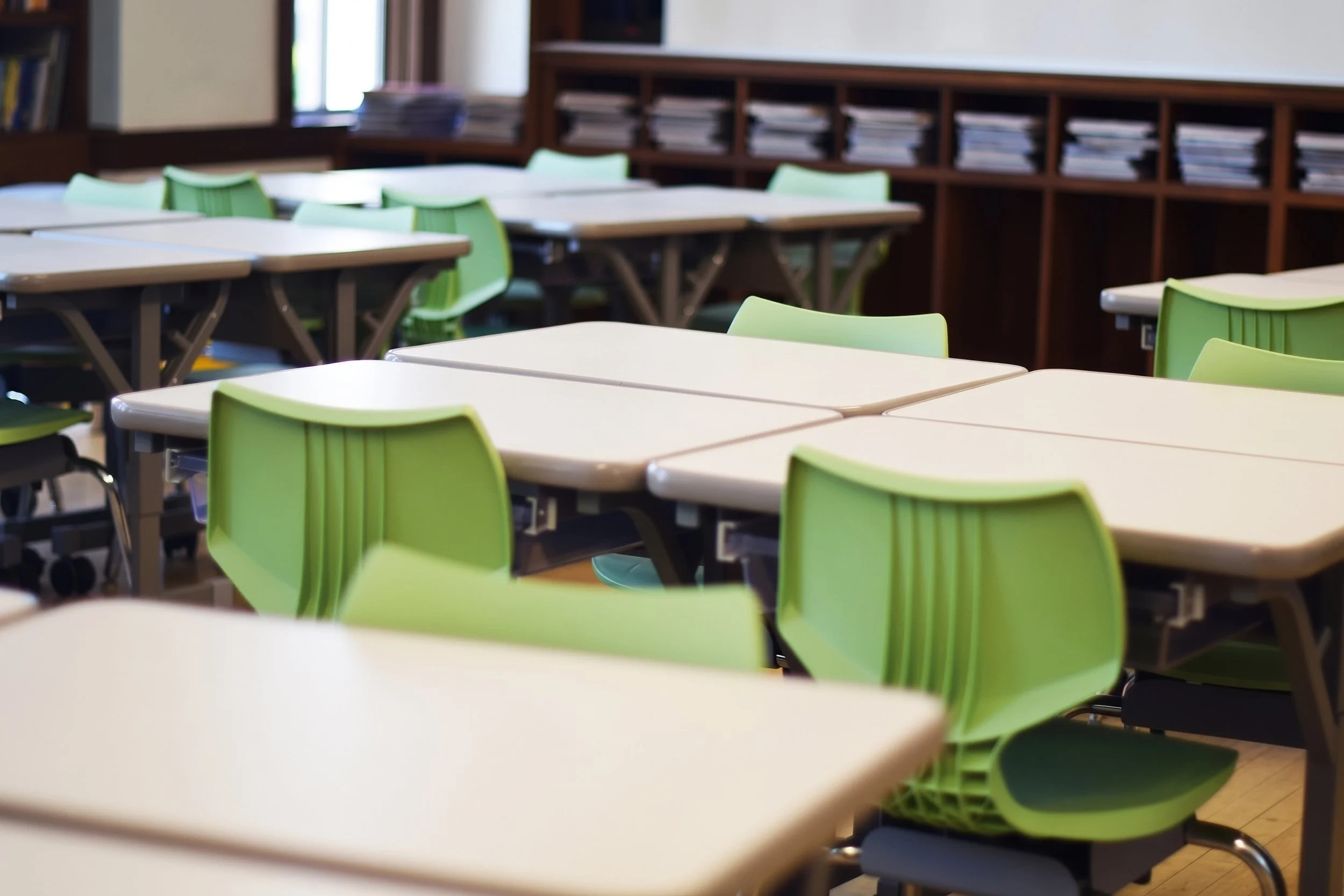 Classroom tables with the cubbies behind.