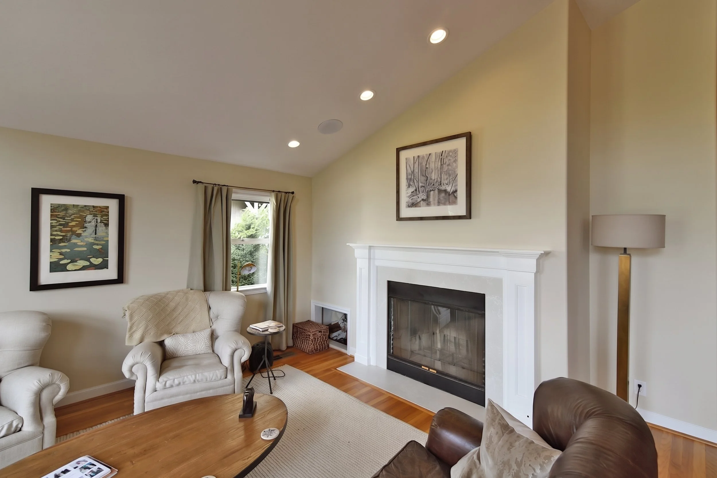 Living room with the fireplace and seating.
