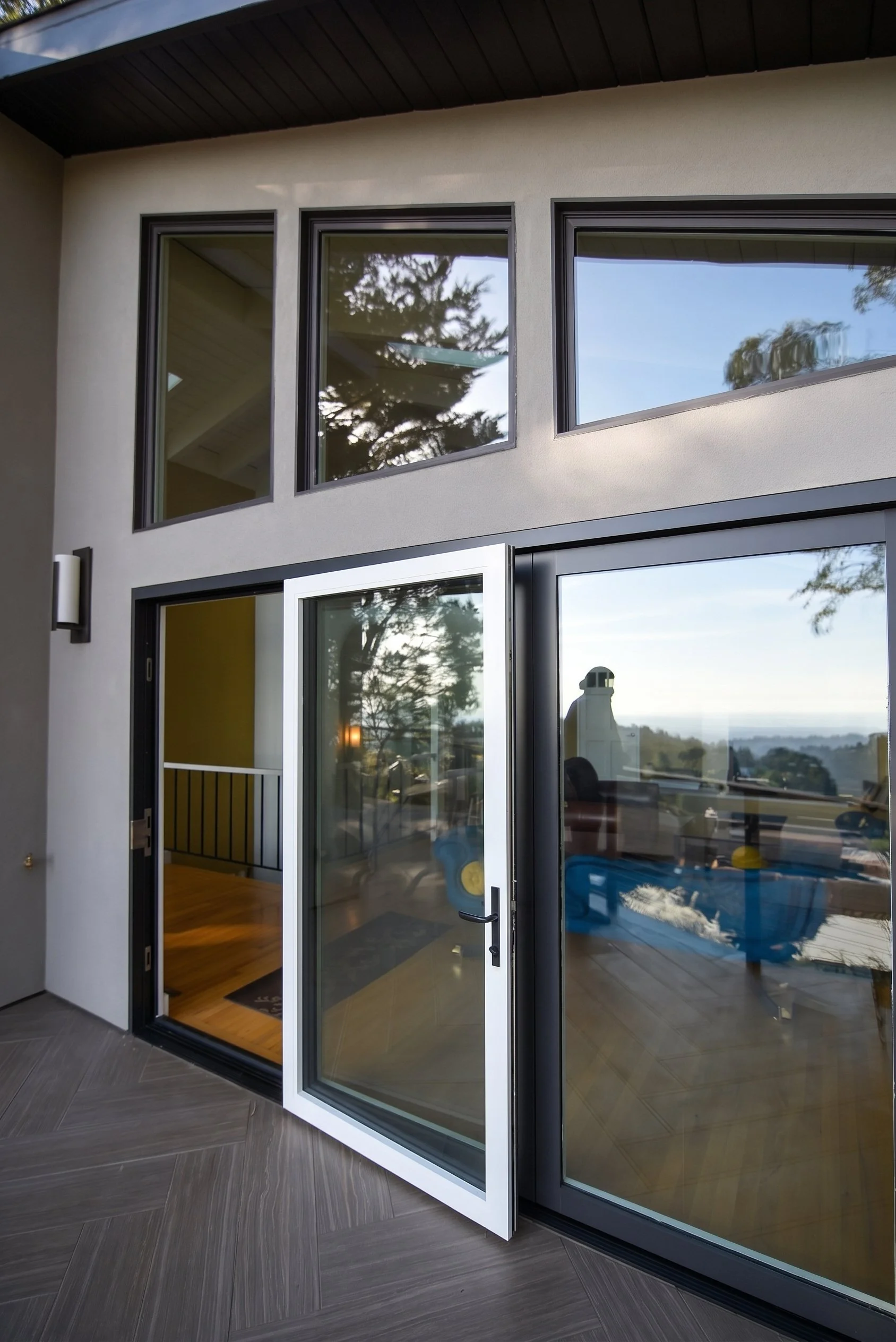 Sliding glass doors opening onto the deck.