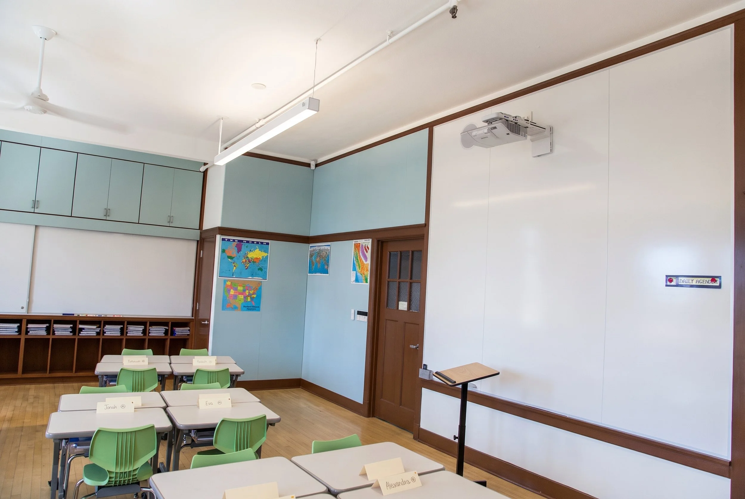 Sliding whiteboard panels beside the classroom door.