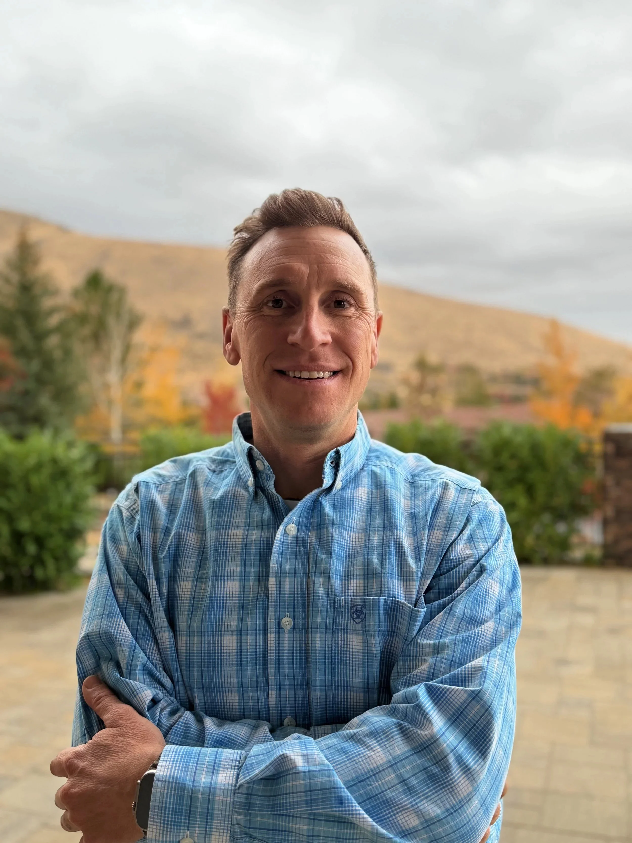Jed Daoust, CEO and Principal of Daoust Design and Construction, outdoors in the Reno foothills