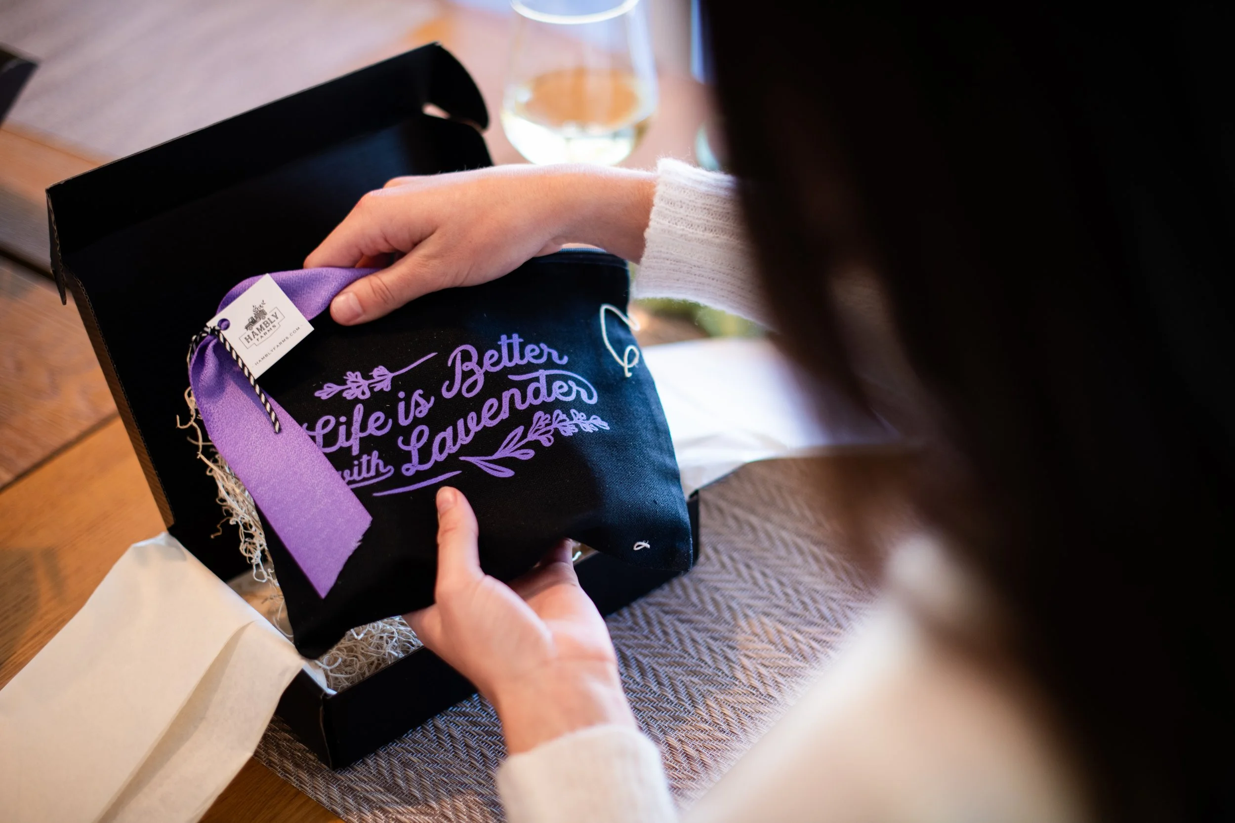 Hambly Farms Take it with you set- gift being opened to received the Life is Better With Lavender Cosmetic Bag and Hambly Farms Lavender Products