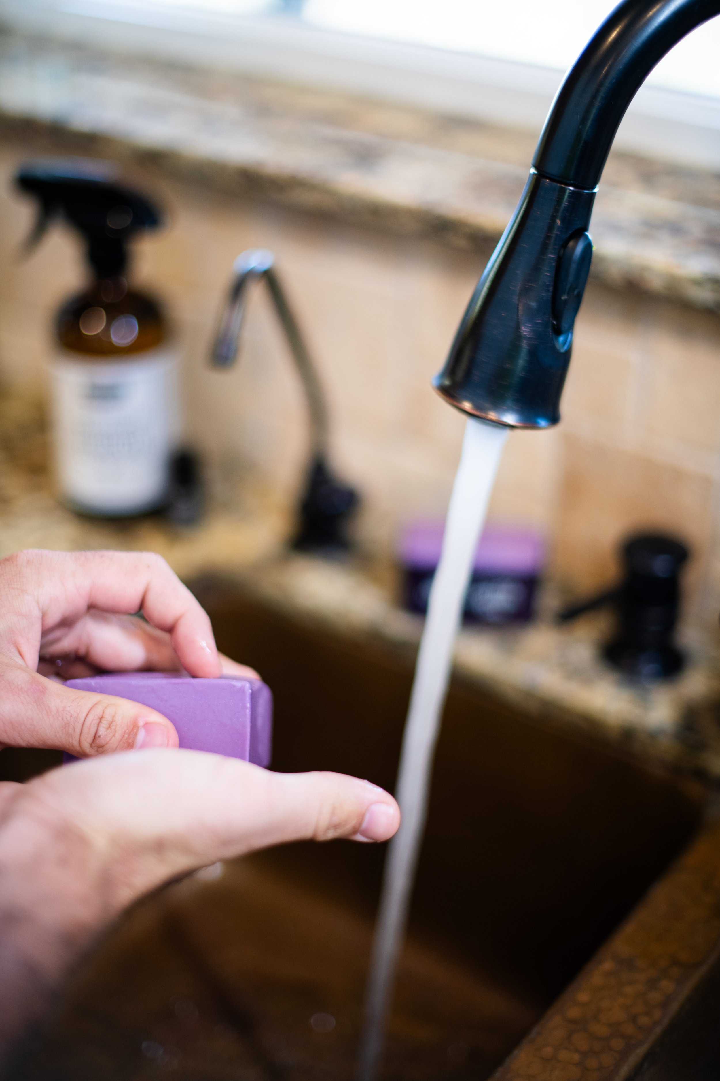 Hambly-Farms-Lavender-Goat-Milk-Soap used to wash hands in a kitchen