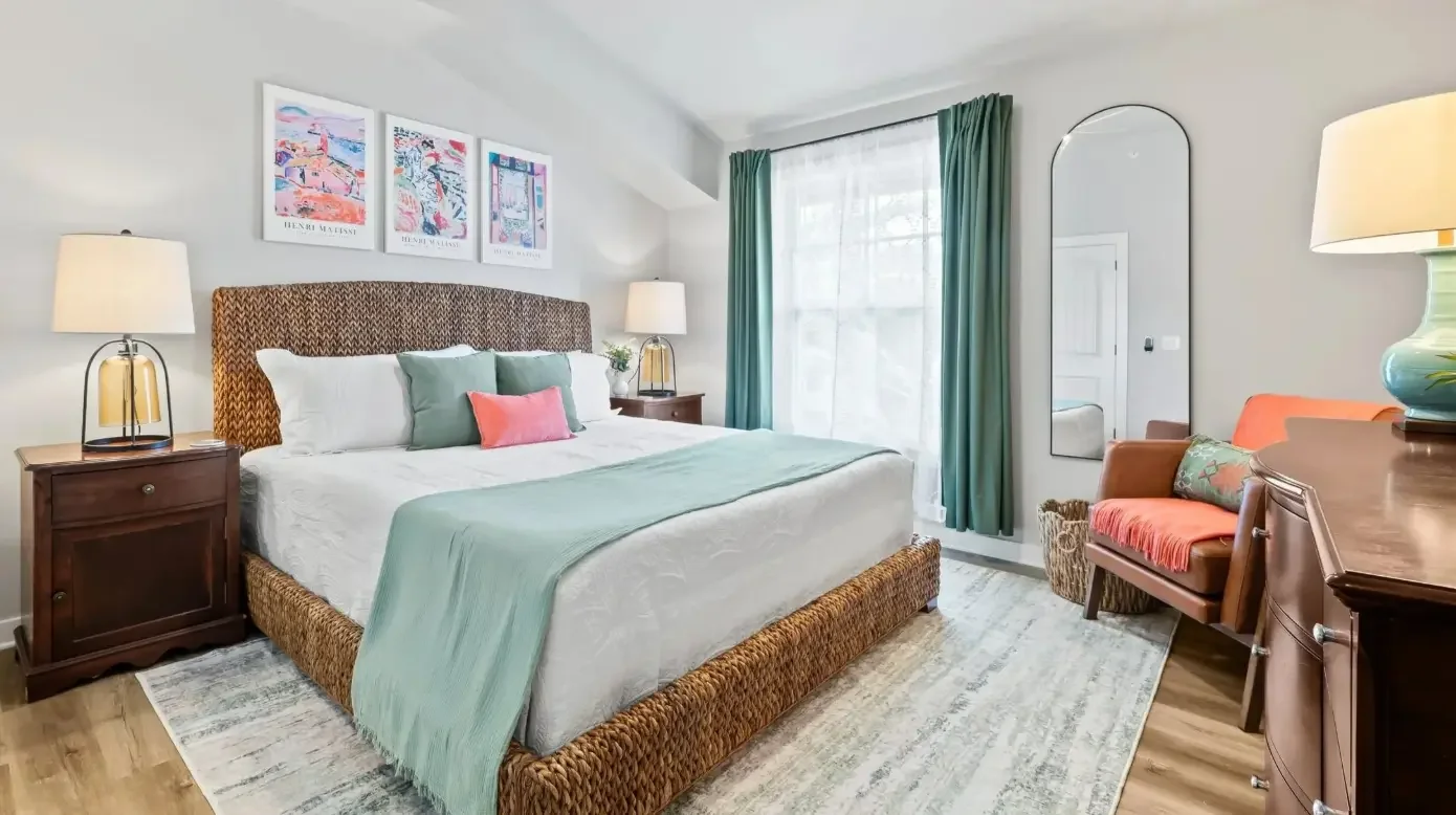 Sage green accents in a bright, modern coastal living room.