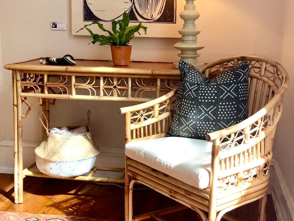 Statement rattan desk by red egg furniture styled to add character, function, and visual interest to a home or guest space.